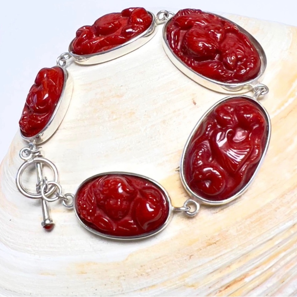 Gorgeous sterling large, carved coral link bracelet, cherubs, and Eagles.